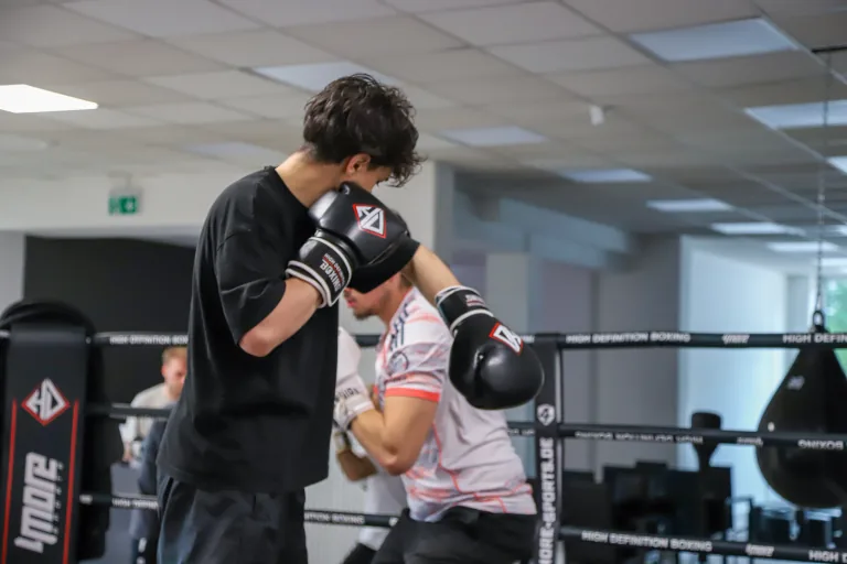 Two boxers practising technique together at HD Boxing
